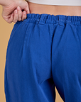 Baggy Mid-Rise Trousers in Royal Blue back close up on Alex