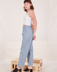 Side view of Organic Trousers in Periwinkle and Cropped Tank Top in vintage tee off-white worn by Alex