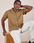 Pantry Button-Up in Desert Brown and vintage tee off-white Western Pants on Isaac