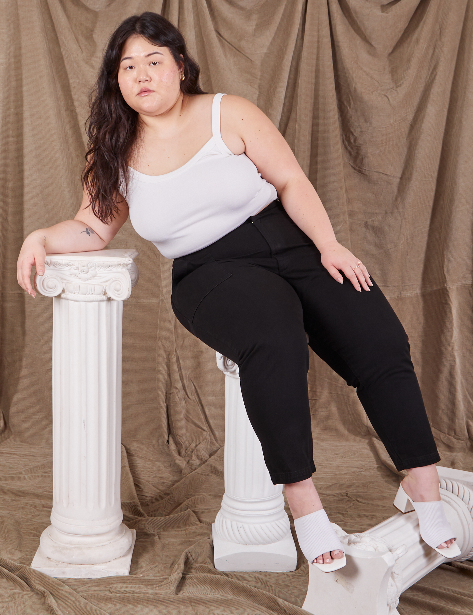 Ashley is wearing Petite Pencil Pants in Basic Black and Cropped Cami in vintage tee off-white 