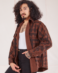 Plaid Flannel Overshirt in Fudgesicle Brown angled view on Jesse