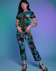 Alex is wearing Work Pants in Rainbow Magic Waters and matching Classic Tee