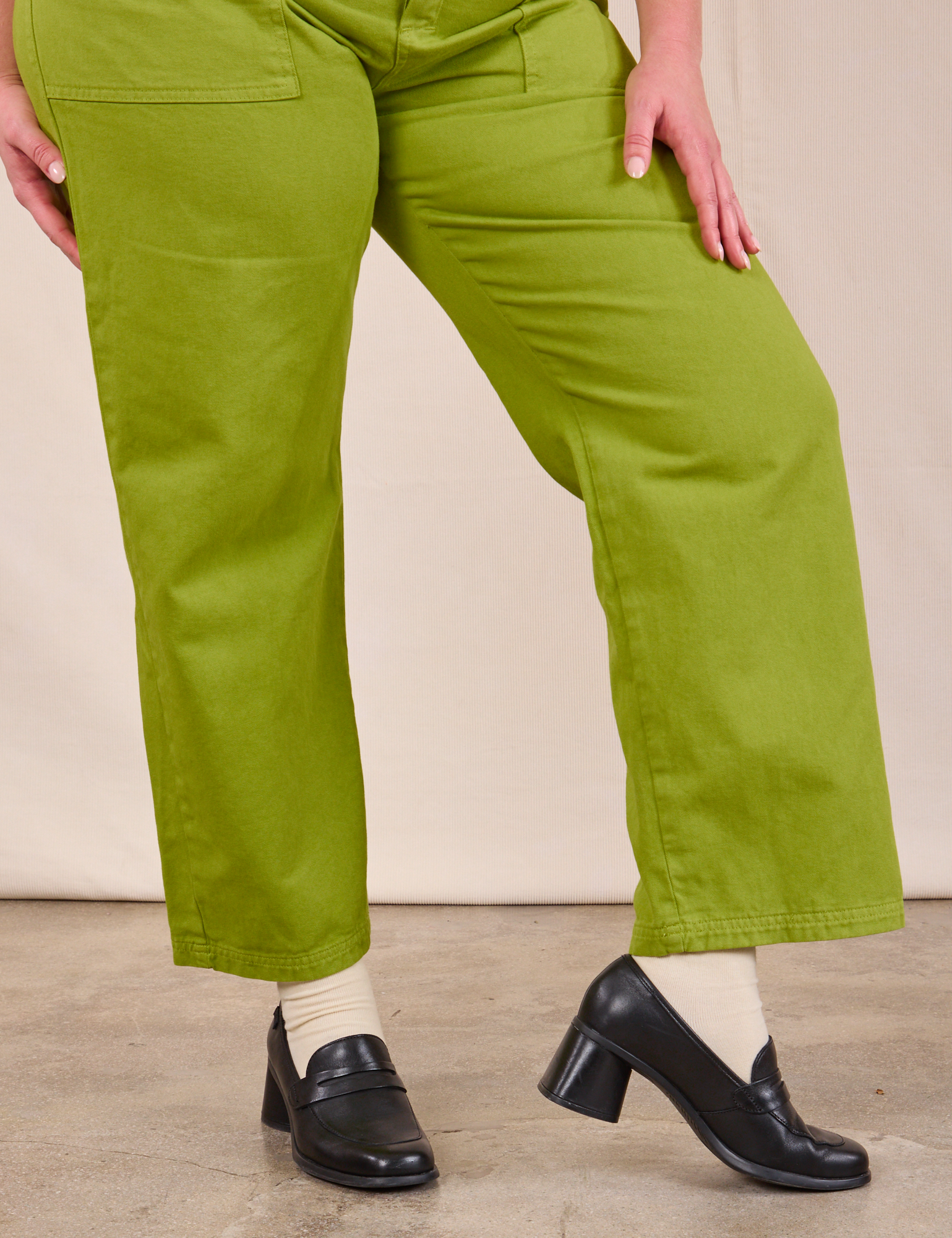 Short Sleeve Jumpsuit in Gross Green pant leg close up on Lish