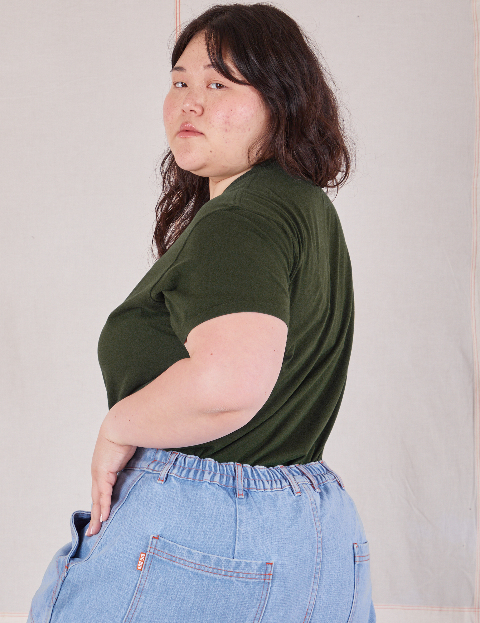 Organic Vintage Tee in Swamp Green side view on Ashley