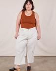Ashley is wearing The Tank Top in Burnt Terracotta tucked into vintage tee off-white Petite Western Pants