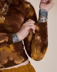 Close up of Long Sleeve Baby Tee in Honey Brown sleeves on Sydney