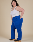 Side view of Work Pants in Royal Blue and vintage tee white Cropped Tank on Ashley