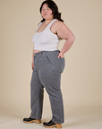 Side view of Work Pants in Washed Grey and Cropped Tank in Vintage Tee White on Ashley