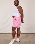 Side view of Classic Work Shorts in Bubblegum Pink and Cropped Tank Top in vintage tee off-white on Elijah