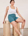 Tiara is wearing Classic Work Shorts in Marine Blue and Cropped Tank Top in vintage tee off-white