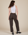 Back view of Heavyweight Trousers in Espresso Brown and Cropped Tank in Vintage Tee White on Alex