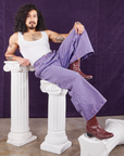 Jesse is wearing Overdyed Wide Leg Trousers in Faded Grape and Cropped Tank Top in vintage tee off-white
