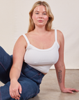 Lish is wearing Cropped Cami in Vintage Tee Off-White and dark wash Carpenter Jeans