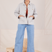 Tiara is wearing Denim Work Jacket in Dishwater White and light wash Sailor Jeans