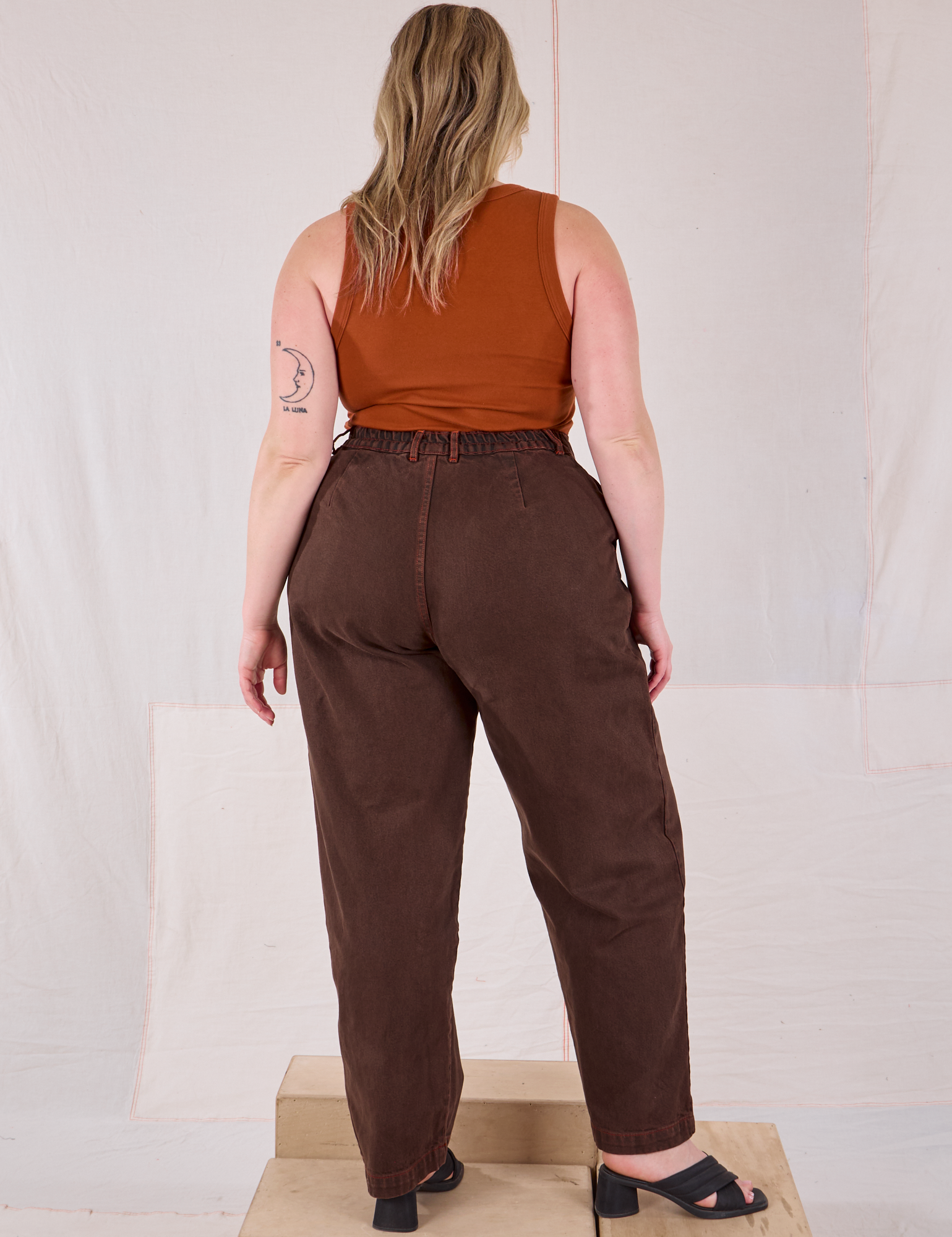 Back view of Overdyed Denim Trouser in Fudge and burnt terracotta Cropped Tank on Lish