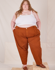 Catie is 5'11" and wearing 4XL Heavyweight Trousers in Burnt Terracotta paired with Cropped Cami in vintage tee off-white