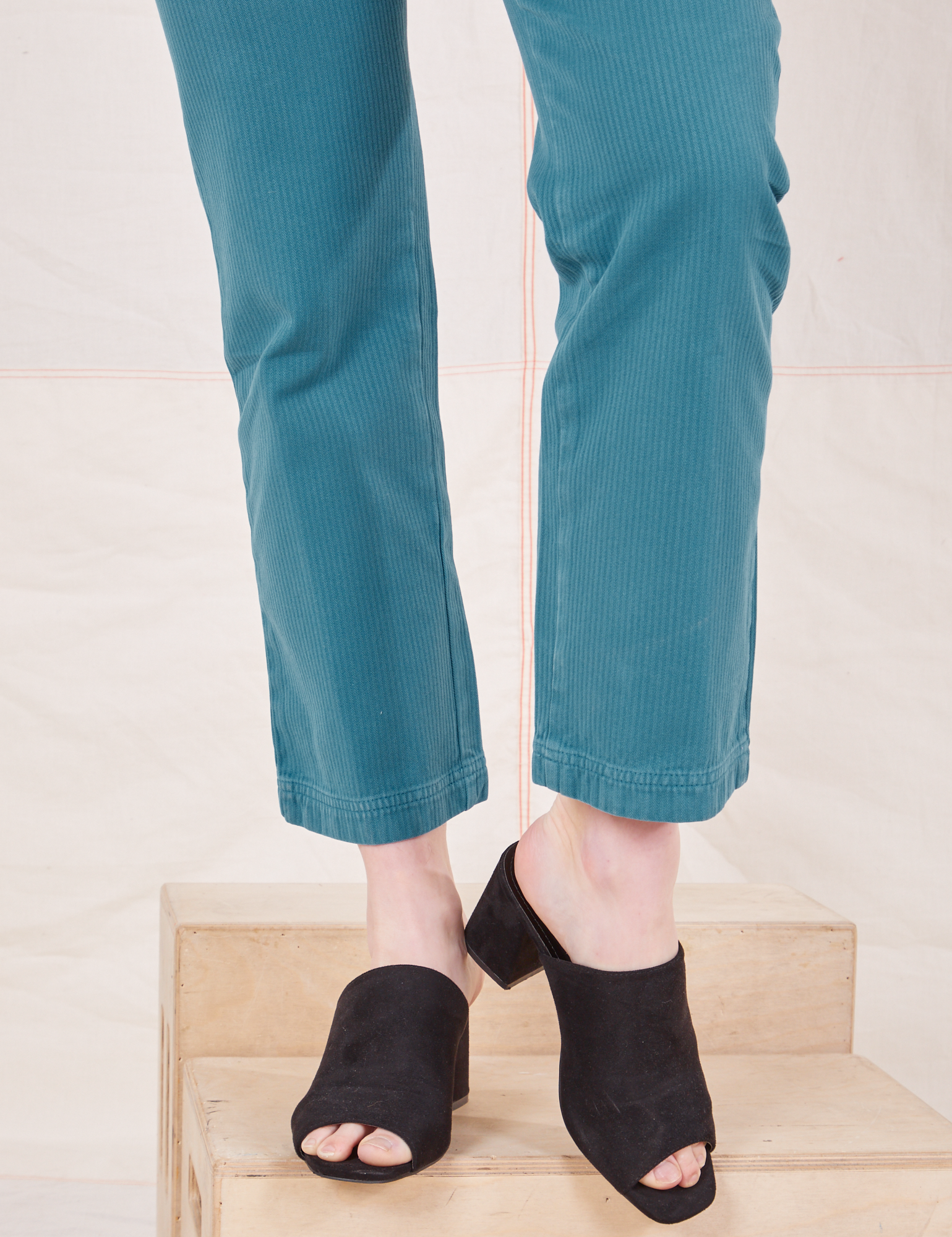 Pant leg close up of Heritage Short Sleeve Jumpsuit in Marine Blue worn by Alex