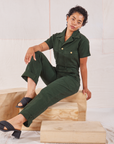 Mika is wearing Heritage Short Sleeve Jumpsuit in Swamp Green