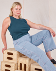 Lish is wearing Muscle Tee in Lagoon and light wash Carpenter Jeans