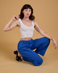 Baggy Mid-Rise Trousers in Royal Blue and vintage tee white Cropped Tank on Alex