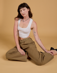 Baggy Mid-Rise Trousers in Desert Brown and vintage tee white Cropped Tank on Alex
