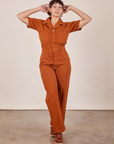 Tiara is wearing Short Sleeve Jumpsuit in Burnt Terracotta