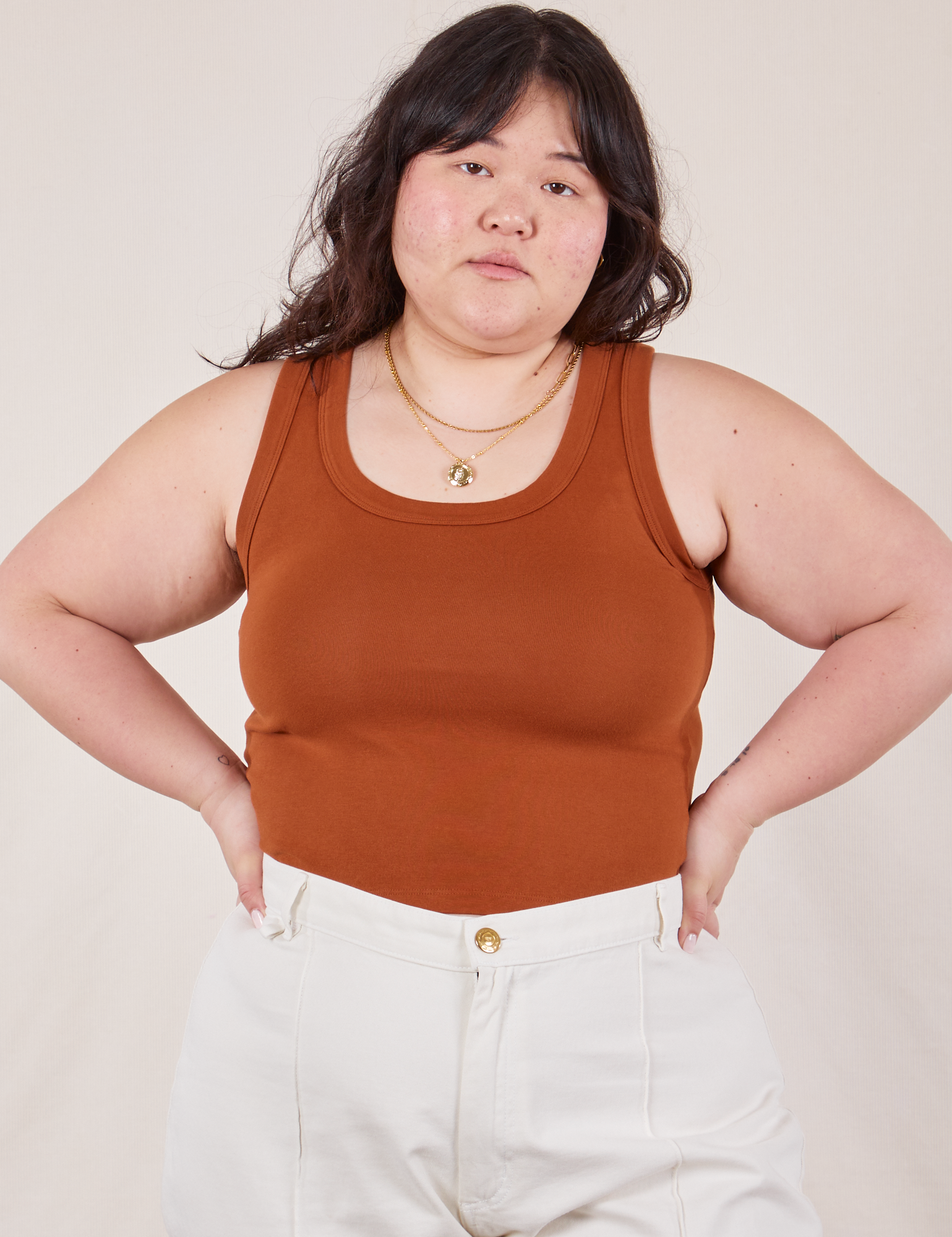 Ashley is wearing The Tank Top in Burnt Terracotta