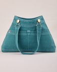 Overall Handbag in Marine Blue with handle down across front