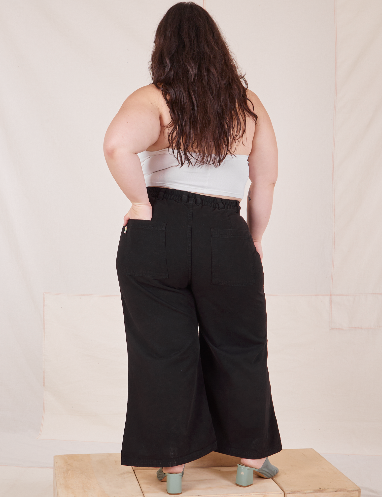 Back view of Petite Bell Bottoms in Basic Black on Ashley