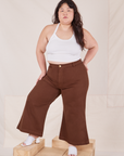 Ashley is 5'7" and wearing 1XL Petite Bell Bottoms in Fudgesicle Brown paired with Halter Top in vintage tee off-white