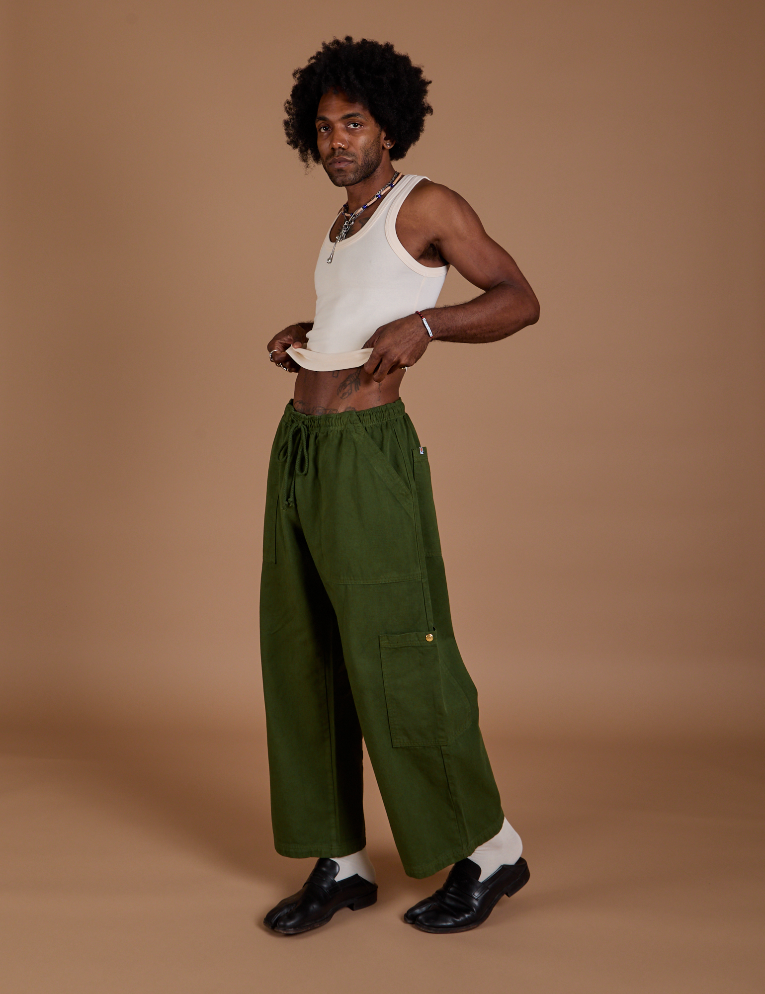 Drop Pocket Cargo Pants in Evergreen angled front view on Jerrod
