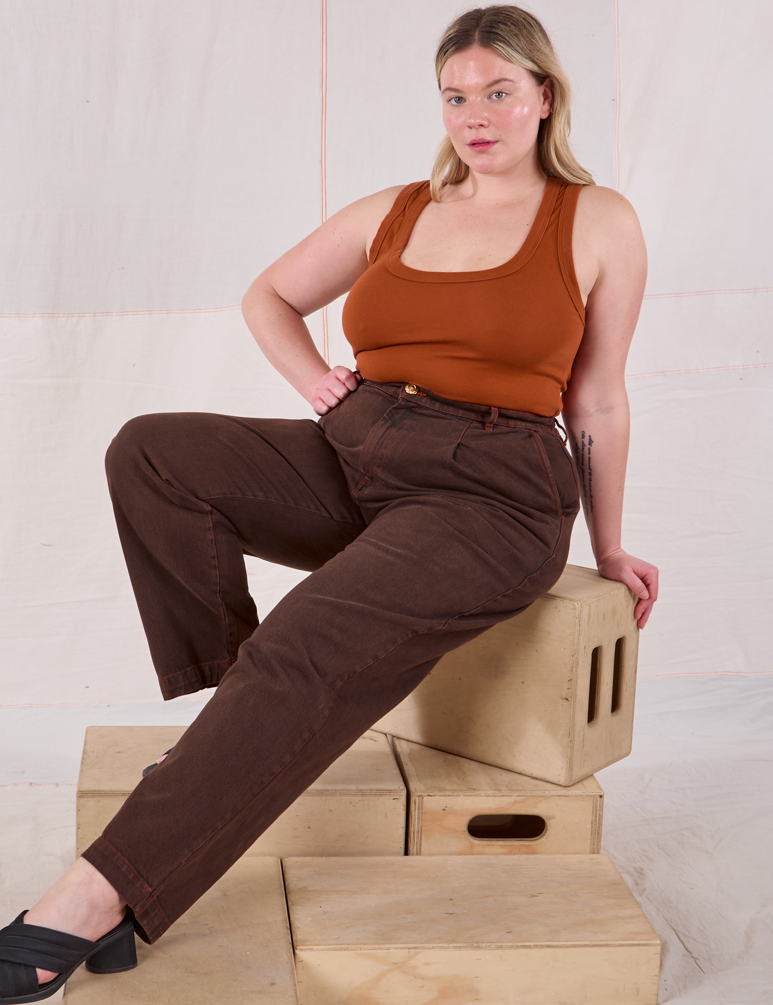 Lish is wearing Overdyed Denim Trouser in Fudge and burnt terracotta Cropped Tank