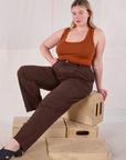 Lish is wearing Overdyed Denim Trouser in Fudge and burnt terracotta Cropped Tank