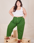 Ashley is 5'7" and wearing 1XL Petite Heavyweight Trousers in Lawn Green paired with Cropped Tank Top in vintage tee off-white