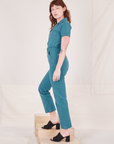 Heritage Short Sleeve Jumpsuit in Marine Blue side view on Alex