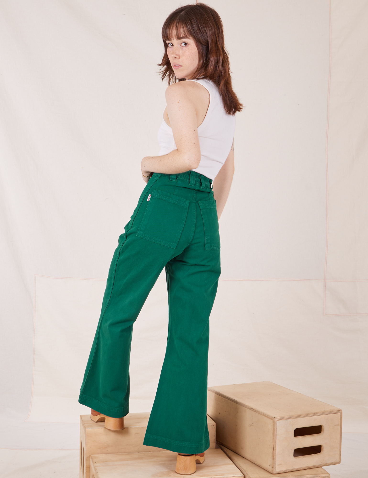Back view of Bell Bottoms in Hunter Green worn by Hana
