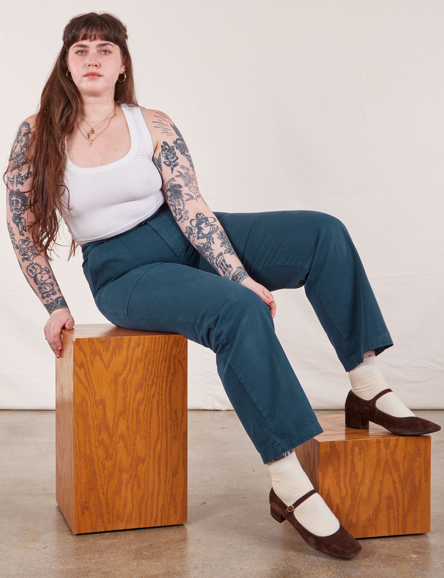 Sydney is wearing Work Pants in Lagoon and vintage tee off-white Cropped Tank