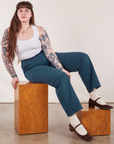 Sydney is wearing Work Pants in Lagoon and vintage tee off-white Cropped Tank
