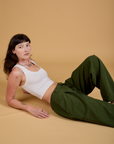 Baggy Mid-Rise Trousers in Evergreen and vintage tee white Cropped Tank on Alex