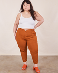 Ashley is 5'7" and wearing 1XL Petite Pencil Pants in Burnt Terracotta paired with vintage off-white Cropped Cami