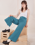 Hana is wearing Petite Bell Bottoms in Marine Blue and Cropped Tank Top in vintage tee off-white