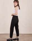 Side view of Petite Pencil Pants in Basic Black and Cropped Tank Top in vintage tee off-white on Hana