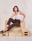Alex is wearing Railroad Carpenter Jeans in Fudgesicle Brown and vintage tee off-white Square Neck Tank