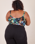 Back view of Cropped Cami in Rainbow Magic Waters and black Western Pants worn by Morgan