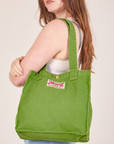 Shopper Tote Bag in Bright Olive worn over shoulder by Allison