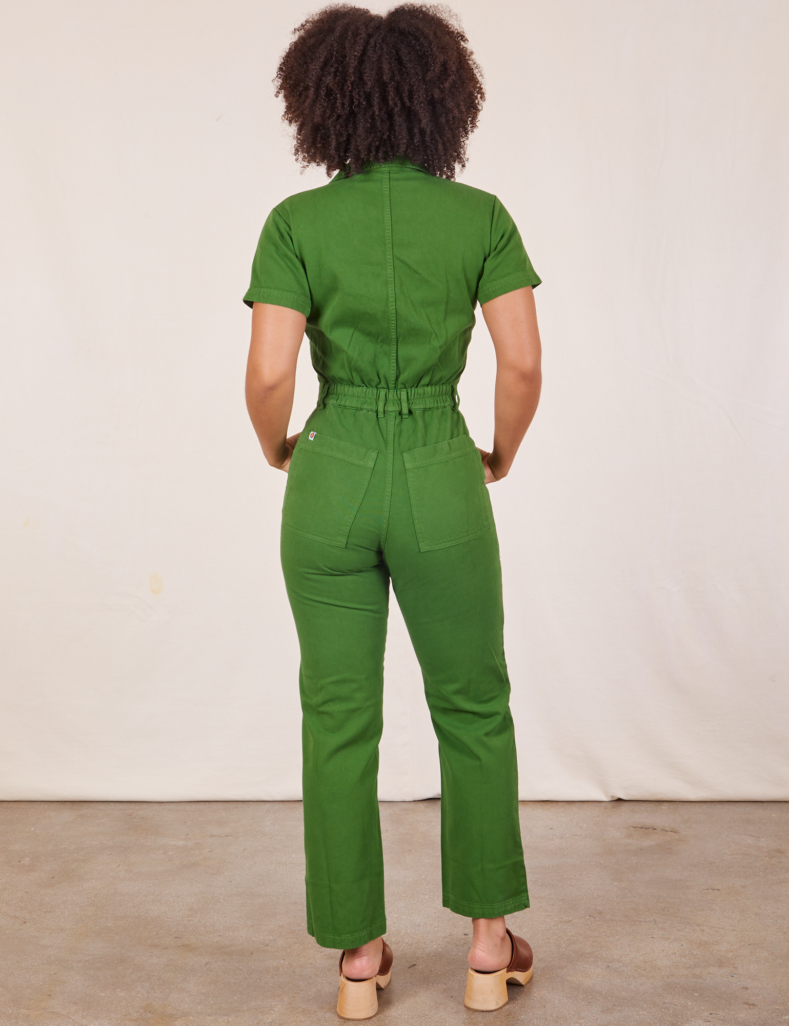 Back view of Short Sleeve Jumpsuit in Lawn Green worn by Gabi