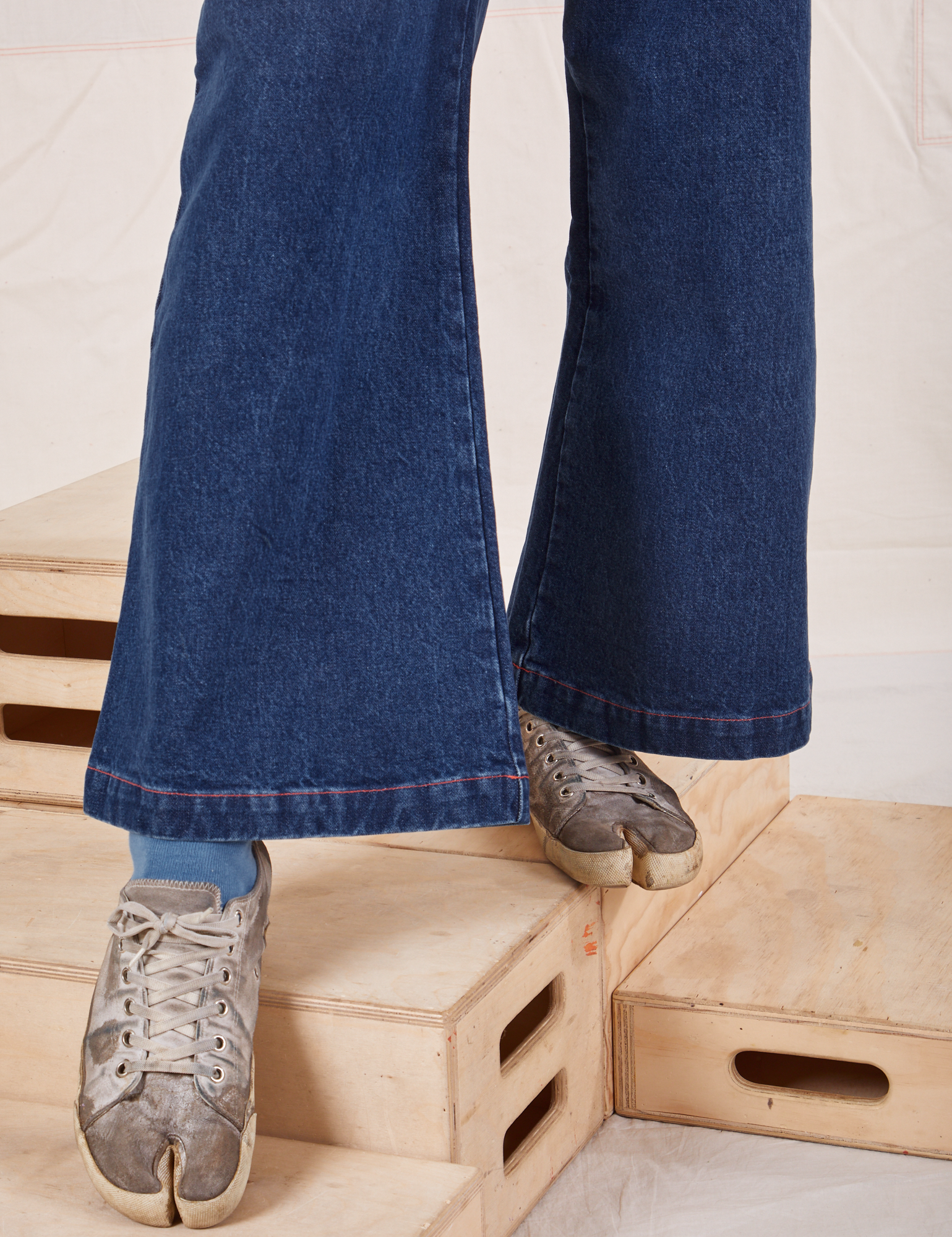 Indigo Wide Leg Trousers in Dark Wash pant leg close up on Jerrod