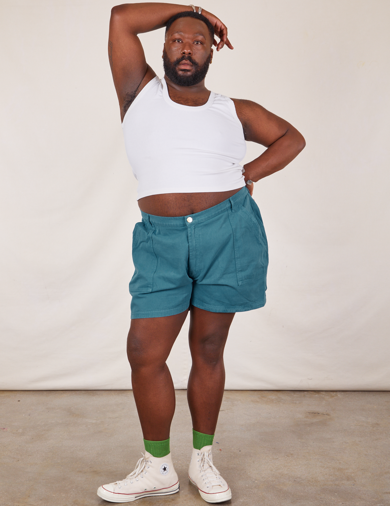 Elijah is 6’0” and wearing 3XL Classic Work Shorts in Marine Blue paired with a Tank Top in vintage tee off-white