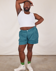 Elijah is 6’0” and wearing 3XL Classic Work Shorts in Marine Blue paired with a Tank Top in vintage tee off-white