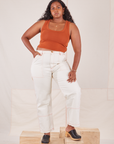 Meghna is 5'8" and wearing L Carpenter Jeans in Vintage Tee Off-White paired with burnt terracotta Cropped Tank Top